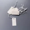 Blank paper hang tags with white elastic strings for DIY writing price display and retail use. - 1.7x3.5cm / White