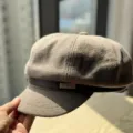 Detailed view of brown wool newsboy cap, showcasing textured fabric and leather strap. - Adult 54-60 Adjustable / Light Khaki