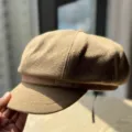 Detail view of the classic retro wool blend newsboy hat with stylish belt buckle accent. - Adult 54-60 Adjustable / Dark Khaki