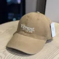 Detail view of the stylish khaki washed cotton baseball cap with front embroidery and wide brim. - Adult 54-60 Adjustable / Caramel color