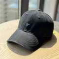 Detailed view of the black washed cotton baseball cap featuring stylish teal letter embroidery. - Adult 54-60 Adjustable / Black