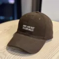 Detailed shot of brown washed baseball cap with white embroidered text on soft cotton crown. - Adult 54-60 Adjustable / Coffee