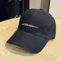 Detail shot of a black cotton baseball cap with embroidered front letters, casual style. - Adult 54-60 Adjustable / Black