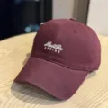 Detail shot of the maroon washed distressed soft top baseball cap with front embroidery. - Adult 54-60 Adjustable / Burgundy