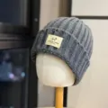 Grey knitted beanie detail, thick wool ribbed texture, winter warm hat front label closeup. - Adult One Size (54-60cm) / Dark Gray