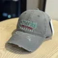 Detailed view of a vintage distressed grey baseball cap with embroidery and frayed brim. - Adult 54-60 Adjustable / Gray