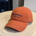 Orange embroidered baseball cap with Coachella letter detail, casual streetwear style. - Adult 54-60 Adjustable / Orange
