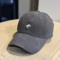 Detailed shot of dark grey baseball cap featuring white E embroidery, casual design and texture. - Adult 54-60 Adjustable / Gray