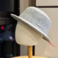 Detailed view of the elegant grey wool bucket hat, stylish autumn and winter fashion accessory. - Adult 54-60 Adjustable / Light Gray