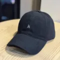 Black washed cotton baseball cap detail, featuring white embroidered letter hi on front. - Adult 54-60 Adjustable / Black