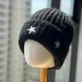Close-up detail of the black knitted beanie featuring sparkling silver star embroidery. - Adult One Size (54-60cm) / Black