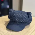 Close up detail view of sweet dark blue polka dot cat ear beret hat, cute style and fabric texture. - Adult 54-60 Adjustable / Navy Blue