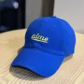 Blue cotton baseball cap with yellow embroidered aime lettering, casual curved brim and soft top. - Adult 54-60 Adjustable / Blue