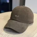 Close-up detail view of the brown corduroy baseball cap with pink embroidered text front. - Adult 54-60 Adjustable / Coffee