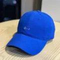 Close-up of royal blue baseball cap with white embroidered text detail and soft top. - Adult 54-60 Adjustable / Blue
