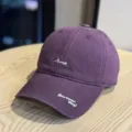 Detail view of purple cotton baseball cap with white embroidery on cap front detail. - Adult 54-60 Adjustable / Purple