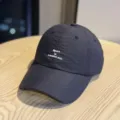 Close-up detail of lightweight quick-dry sports baseball cap with inspiring text print. - Adult 54-60 Adjustable / Black