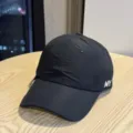 Detail view of the black quick-drying baseball cap with white embroidered letters. - Adult 54-60 Adjustable / Black
