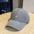 Detail shot of a minimalist grey quick-dry waterproof baseball cap with white embroidery. - Adult 54-60 Adjustable / Dark Gray