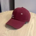 Burgundy baseball cap detail shot, showing exquisite white letter embroidery and side text design. - Adult 54-60 Adjustable / Burgundy