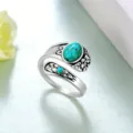 Vintage zilveren open ring met turkoois steen en gedetailleerd bloemmotief voor vrouwen. - Gesimuleerde Turquoise Stijl / Zilver