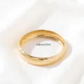 Close-up detail shot of wide gold open bangle bracelet on white fabric, smooth metal finish. - Style 3 / Gold (Thickness 1.5cm)