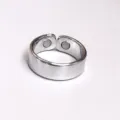 Close-up detail of silver adjustable magnetic therapy health ring with embedded round magnets. - 2 Magnets Silver