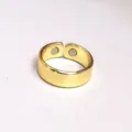 Close-up view of gold open magnetic health ring showing inner magnetic beads detail. - 2 Magnets Gold