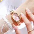 Élégante montre à quartz ovale pour femme bracelet en acier doré et cadran rose chic - Or Rose