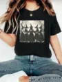 Detailed view of a black short-sleeve t-shirt featuring a vintage witch graphic and lettering. - S / Tops / Black
