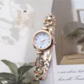 Exquisite women's quartz bracelet watch with rose gold finish and sparkling rhinestone details. - Rose Gold