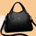 Sac à main élégant en cuir PU noir pour femme sac bandoulière avec rivets et cœur décoratif - Noir