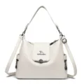 Elegante borsa a tracolla bianca da donna, grande capacità e pratico design multi-scomparto. - Bianco avorio