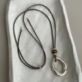 Chic Maillard style adjustable brown cord necklace with irregular metal oval pendant and tiger's eye. - Style 1 (Composite Element Pendant)