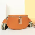 Orange leather saddle bag for women, stylish casual crossbody chest bag with wide strap. - Tan