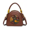Vintage in relief lederen handtas met bloemvogel motief en uniek bamboe handvat design. - Pauwbloemen