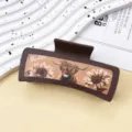 Brown leather hair claw clip featuring a western highland cow and sunflower pattern design. - Dark Coffee Brown Bull Head