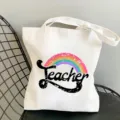 White canvas tote bag featuring a cute rainbow teacher print for daily shopping and commute. - Style 4 (Rainbow Teacher) / 35x40cm