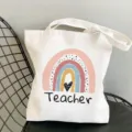 White canvas tote bag featuring a cute rainbow and teacher print, casual shoulder style. - Style 11 (Love Teacher Heart) / 35x40cm