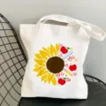 Canvas tote bag with cute sunflower and teacher print, casual shoulder shopping bag for daily use. - Style 12 (Sunflower Apple Pencil) / 35x40cm