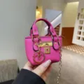 Mini pink top handle shoulder bag with metal lock and chain strap for women chic style. - Rose Red