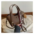 Brown leather tote shoulder bag for women, stylish commuting handbag with charm and strap. - With Pendant / Coffee