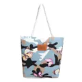 Detailed view of the canvas tote bag featuring a stylish blue camouflage butterfly print and handles. - Butterfly