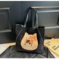 Schwarze Stoff-Tragetasche mit Katzenstickerei, lässige große Schultertasche für Damen. - Schwarz