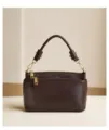 Detailed view of the brown leather top handle bag, showing fine texture and golden hardware. - 23*11*13.5 / Ebony