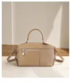 Premium top layer cowhide leather handbag detail view, showing fine stitching and texture. - Khaki