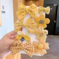 Cute yellow hair clips set for girls, sweet bow and flower hairpins for kids styling. - Bowknot Style (TFJ013-1#) / 8-piece Set / Turmeric