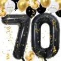 Detail of 40-inch black number 70 balloon with gold confetti and festive party decorations. - Number 70 Set