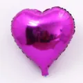 Heart shaped foil balloon detail view, glossy magenta surface for party decoration layout. - Heart / 18 Inch / Rose Red