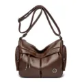Vintage brown leather shoulder bag with multi-pockets and tassel detail for daily commute. - Coffee Brown